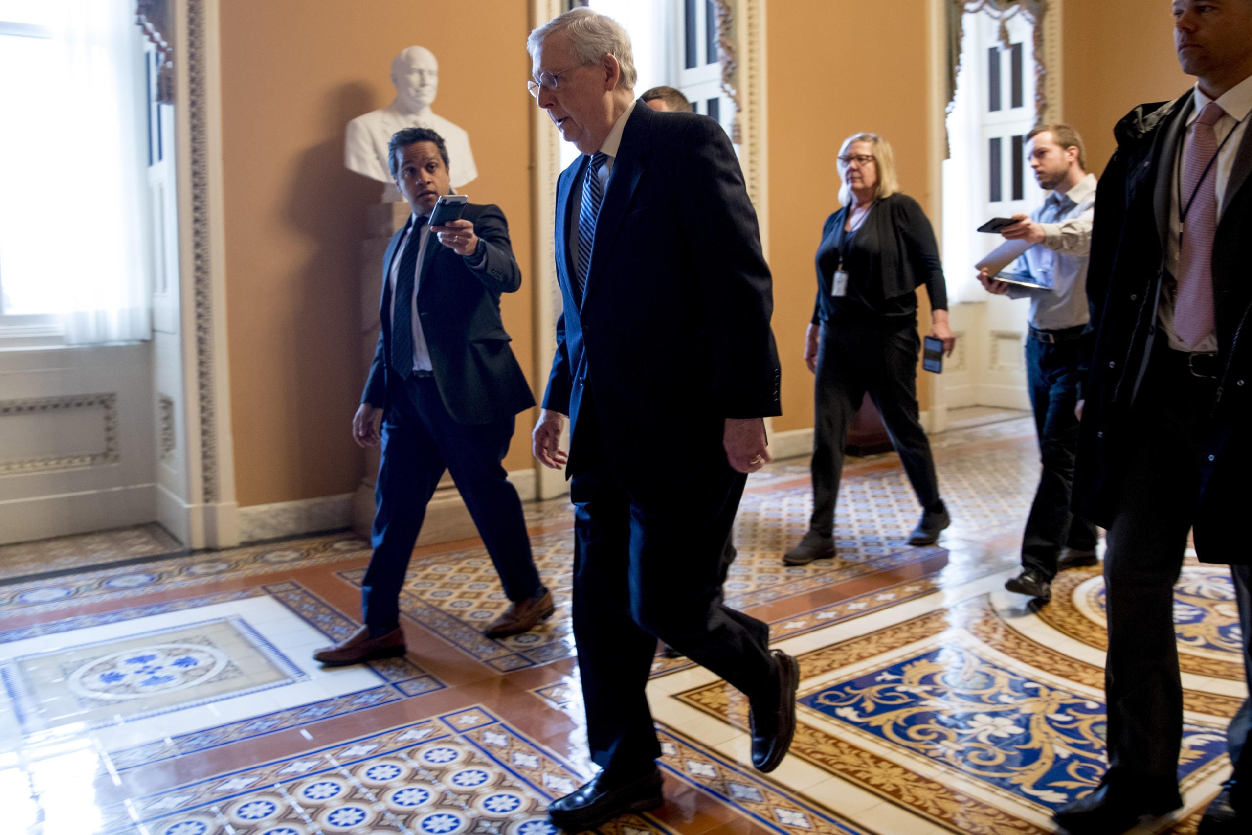 Senate Majority Leader Mitch McConnell of Ky. arrives on Capitol Hill in Washington, Monday, March 23, 2020, as the Senate is working to pass a coronavirus relief bill.