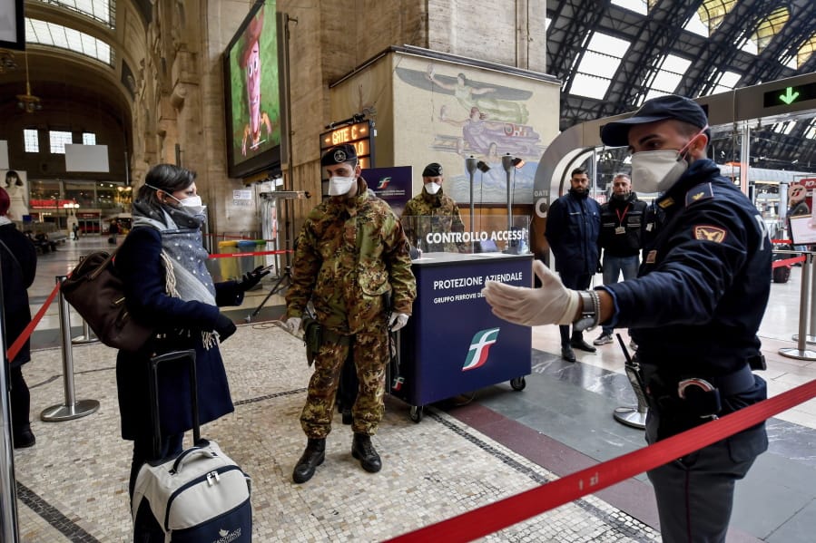 Police officers and soldiers check passengers leaving from Milan main train station, Italy, Monday, March 9, 2020. Italy took a page from China&#039;s playbook Sunday, attempting to lock down 16 million people -- more than a quarter of its population -- for nearly a month to halt the relentless march of the new coronavirus across Europe. Italian Premier Giuseppe Conte signed a quarantine decree early Sunday for the country&#039;s prosperous north. Areas under lockdown include Milan, Italy&#039;s financial hub and the main city in Lombardy, and Venice, the main city in the neighboring Veneto region.