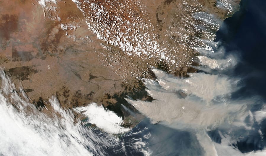 FILE - This satellite image provided by NASA on Saturday, Jan. 4, 2020 shows wildfires in Victoria and New South Wales, Australia. Climate change raised the chances of Australia&#039;s extreme fire season by at least 30%, according to a study released Wednesday, March 4, 2020, by climate scientists at the World Weather Attribution group.