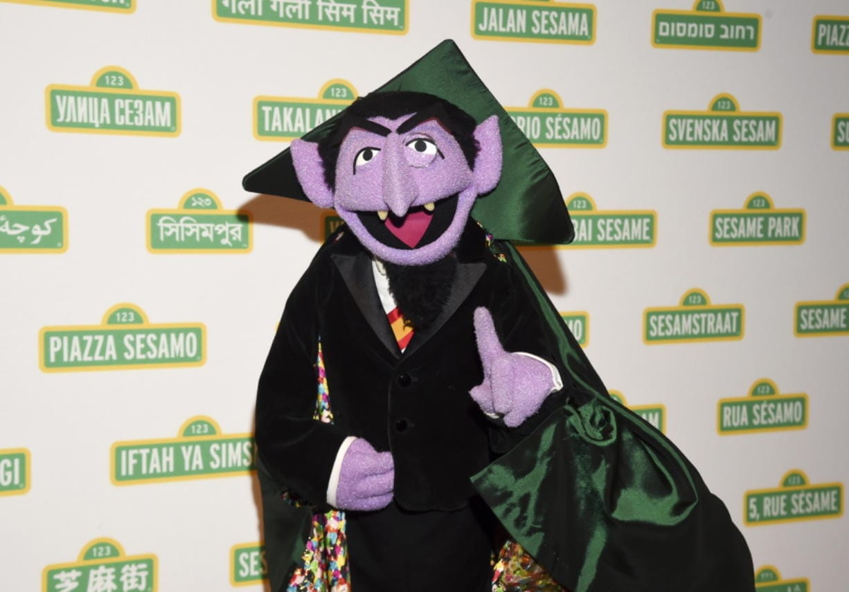 FILE - This May 30, 2018 file photo shows Sesame Street character Count von Count at Sesame Workshop&#039;s 16th annual Benefit Gala in New York. The Muppet best known as the Count is joining Elmo, Rosita and her mom, Rosa, in public service announcements airing Monday, March 9, 2020, to encourage parents of young children to make sure they and their children are counted in the 2020 census.