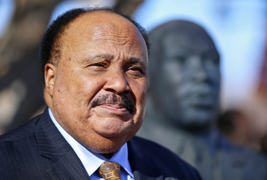 FILE - In this Jan. 25, 2018, file photo, Martin Luther King III stands next to a bust of his father, the Rev. Martin Luther King Jr., during a wreath laying ceremony on, at Kansas State University in Manhattan, Kan. King, as well as family members of Nathaniel Woods, a condemned Alabama inmate, are asking the governor to to stop his execution. Woods is scheduled to be executed on Thursday, March 5, 2020. Woods and co-defendant Kerry Spencer were convicted of capital murder for the 2004 killings of three Birmingham police officers. Spencer was also sentenced to death for the killings.