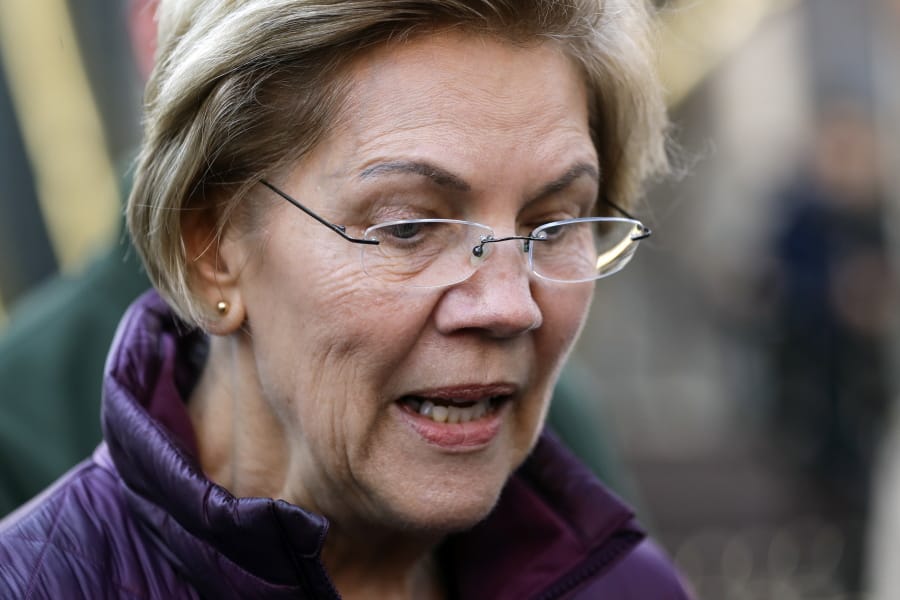 Sen. Elizabeth Warren, D-Mass., speaks to the media outside her home, Thursday, March 5, 2020, in Cambridge, Mass., after she dropped out of the Democratic presidential race.