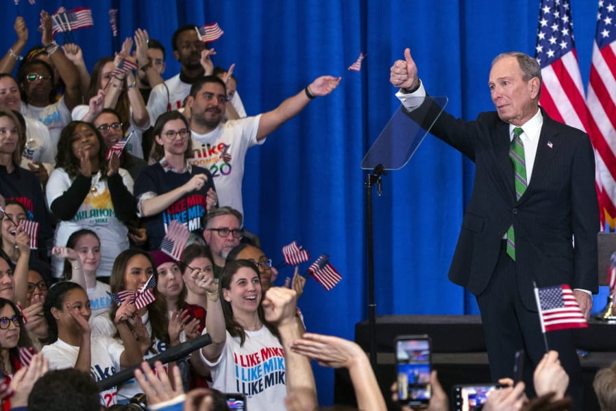 Former Democratic presidential candidate Mike Bloomberg gestures to supporters as he announces the suspension of his campaign and his endorsement of former Vice President Joe Biden for president in New York Wednesday , March 4, 2020.