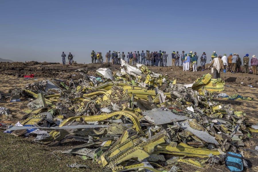 Wreckage is piled March 11, 2019, at the crash scene of Ethiopian Airlines Flight ET302 near Bishoftu, Ethiopia.