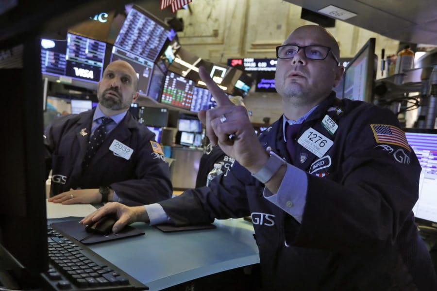 Specialists James Denaro, left, and Mario Picone work on the floor of the New York Stock Exchange, Tuesday, March 10, 2020. Stocks, Treasury yields and oil are clawing back some of the plunge they took a day before, when the S&amp;P 500 had its worst drop in more than a decade.