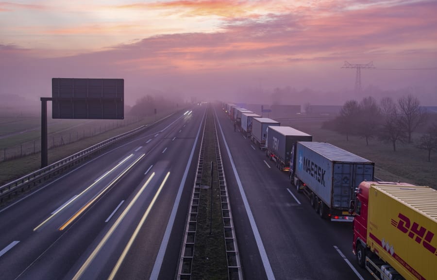 Trucks are jammed in the early morning on Autobahn 12 in front of the German-Polish border crossing near Frankfurt (Oder), Germany, Wednesday, March 18, 2020. In order to make it more difficult for the corona virus to spread, Poland had reintroduced controls at the border crossings to Germany. For most people, the new coronavirus causes only mild or moderate symptoms, such as fever and cough. For some, especially older adults and people with existing health problems, it can cause more severe illness, including pneumonia.