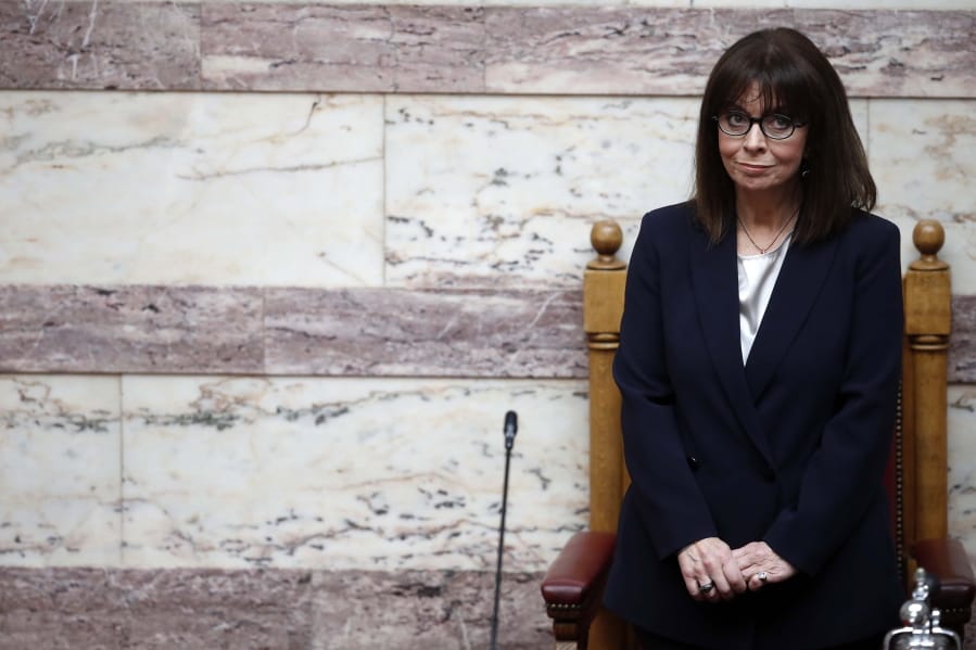 Newly elected Greek President Katerina Sakellaropoulou waits during the swearing in ceremony at the Greek Parliament in Athens, on Friday, March 13, 2020. Greece&#039;s first female president, a former high court judge, was being formally sworn in to office Friday, nearly two months after the country&#039;s parliament voted overwhelmingly to elect her. The swearing in ceremony for Katerina Sakellaropoulou was being held Friday in an almost empty parliament, as part of measures being taken to prevent the spread of the new coronavirus.