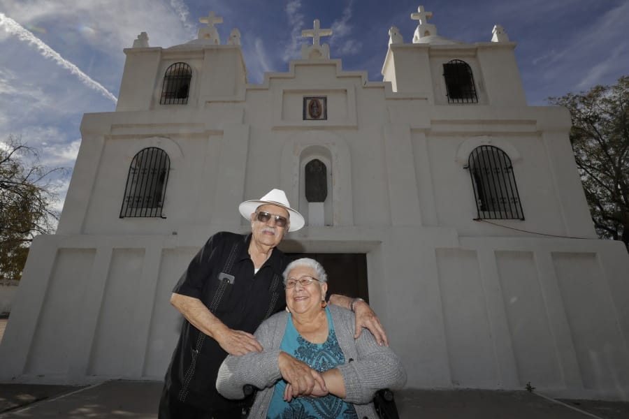Frank and Ester Cota pose for a photograph outside Our Lady of Guadalupe church Friday, Jan. 24, 2020 in Guadalupe, Ariz. Founded by Yaqui Indian refugees from Mexico more than a century ago, Guadalupe is named for Mexico&#039;s patron saint, Our Lady of Guadalupe, and is fiercely proud of its history. The town known for sacred Easter rituals featuring deer-antlered dancers also is wary of outsiders as it prepares for the 2020 census.