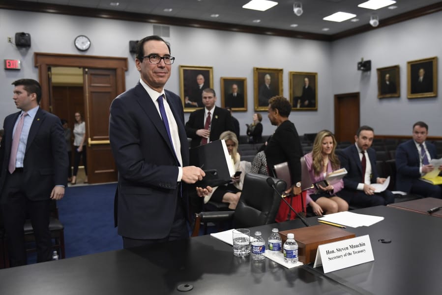 Treasury Secretary Steven Mnuchin stands up after testifying on Capitol Hill in Washington, Wednesday, March 11, 2020, during a House Appropriations subcommittee hearing on the FY&#039;21 budget.