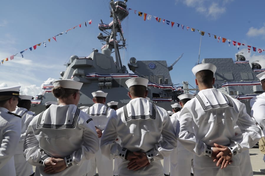 FILE - In this Saturday, July 27, 2019, file photo, sailors stand during a commissioning ceremony for the U.S. Navy guided missile destroyer USS Paul Ignatius, at Port Everglades in Fort Lauderdale, Fla. The U.S. Navy is releasing a strategy that describes plans to overhaul its approach to education because the nation no longer has a massive economic and technological edge over potential adversaries.