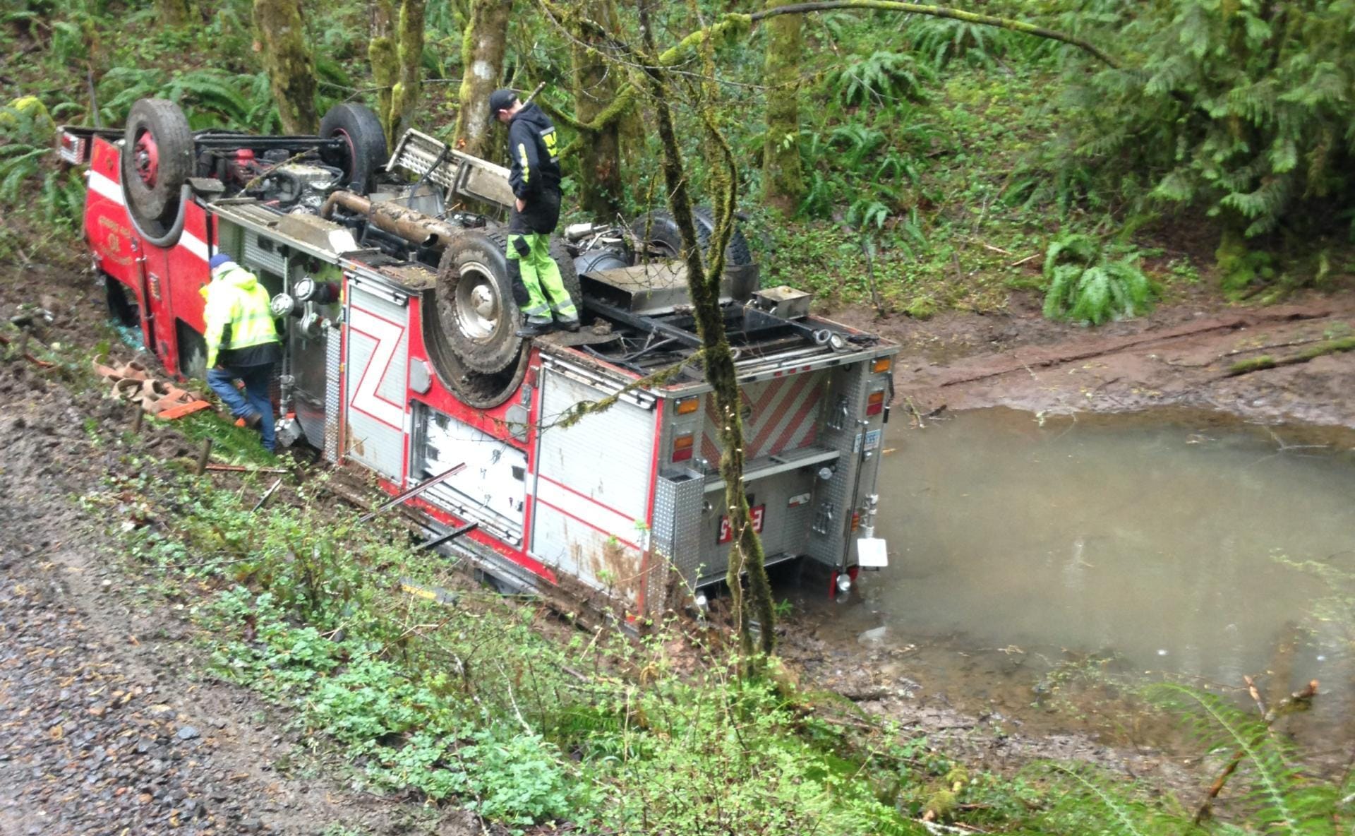 A Clark County Fire District 10 engine rolled over off a narrow unpaved road northeast of La Center on Monday. Crews were responding to a sick call.