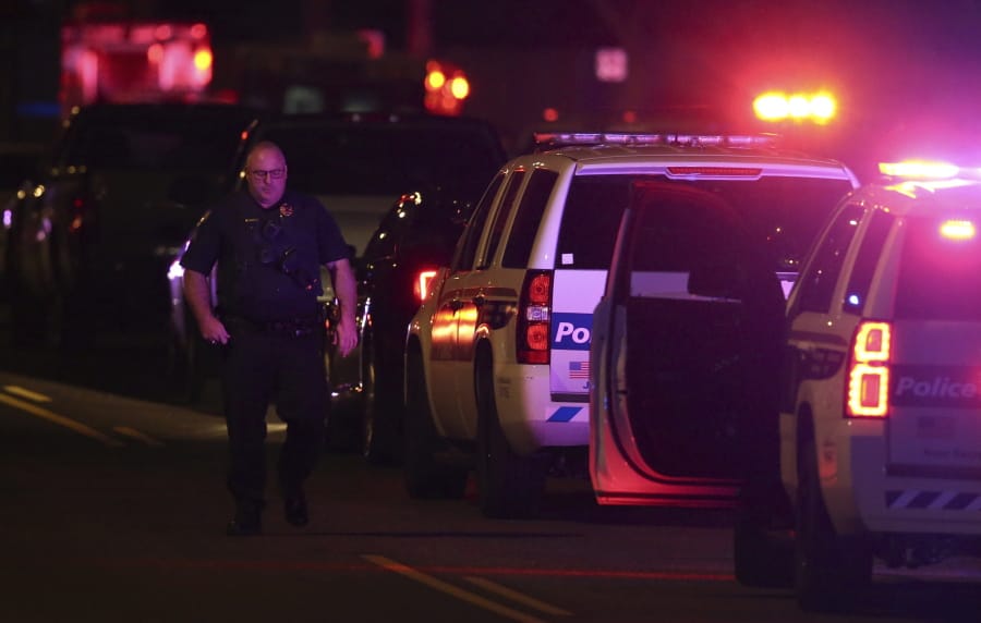 A Phoenix Police officer arrives on the scene of a shooting in Phoenix, Ariz., Sunday, March 29, 2020. At least three Phoenix police officers were shot Sunday night on the city&#039;s north side, authorities said. (AP Photo/Ross D.