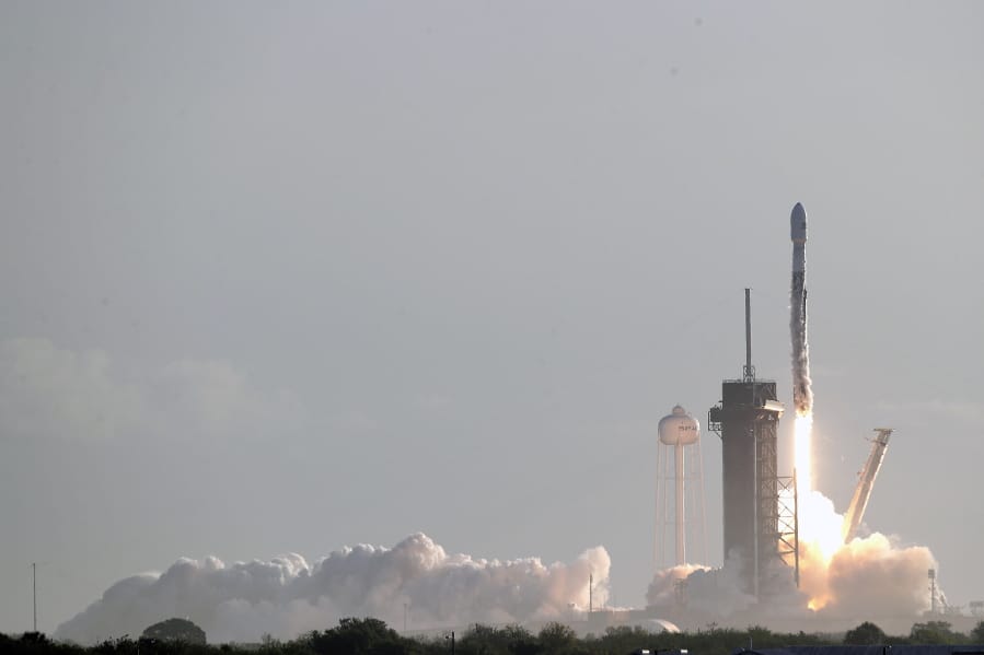 A Falcon 9 SpaceX rocket with a payload of approximately 60 satellites for SpaceX&#039;s Starlink broadband network lifts off from pad 39A at the Kennedy Space Center in Cape Canaveral, Fla., Wednesday, March 18, 2020.