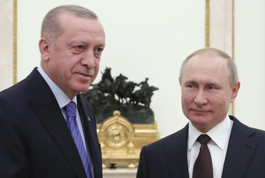 Russian President Vladimir Putin, right, and Turkish President Recep Tayyip Erdogan pose during their meeting in the Kremlin, in Moscow, Russia, Thursday, March 5, 2020. The Turkish and Russian leaders are set to hold talks in Moscow aimed at avoiding pitting their nations against each other, during hostilities in northwestern Syria.