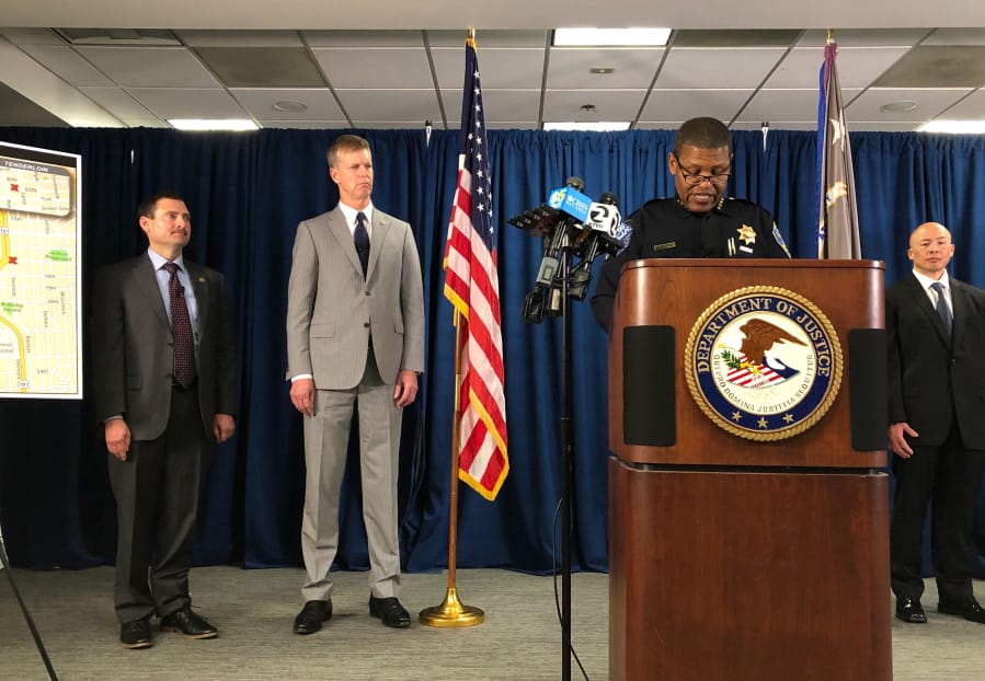 San Francisco Police Chief William Scott, speaking at the podium, joins Federal authorities announcing, Friday, March 13, 2020, indictments against 17 alleged members and associates of the MS-13 gang, saying they were trying to take over San Francisco&#039;s Mission neighborhood. Homeland Security Investigations special agent in charge Tatum King, left and second from left is U.S. Attorney for Northern California David Anderson.