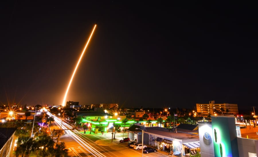 In a time exposure, a SpaceX Falcon is launched from Cape Canaveral, Fla., Friday night, March 6, 2020, with a load of supplies for the International Space Station. Cocoa Beach, Fla., is in the foreground.