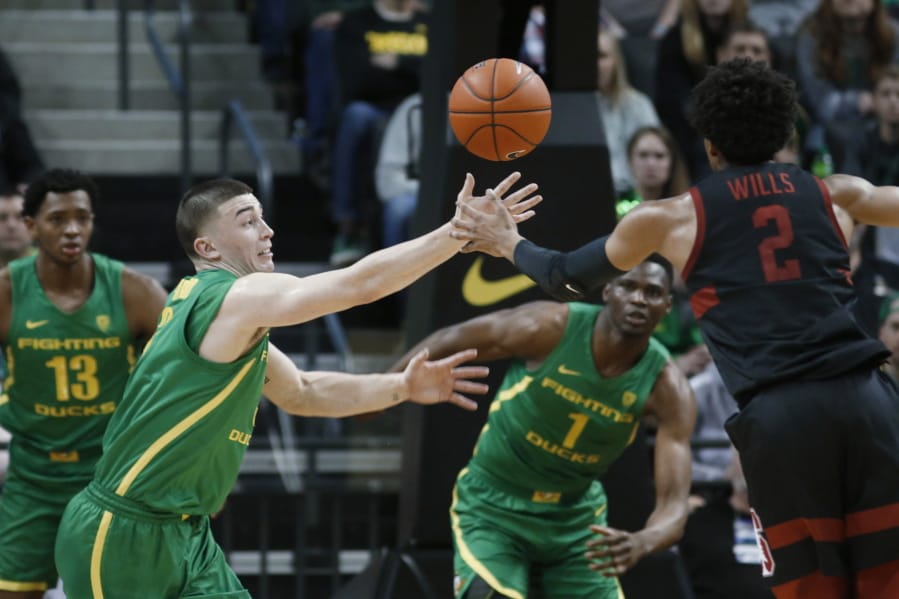 Oregon guard Payton Pritchard (3) steals the ball from Stanford guard Bryce Wills (2) during the first half of an NCAA college basketball game in Eugene, Ore., Saturday, March 7, 2020.