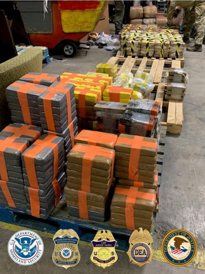 A large haul of drugs seized in a cross-border tunnel running from warehouses in Tijuana, Mexico, to San Diego are displayed in San Diego.
