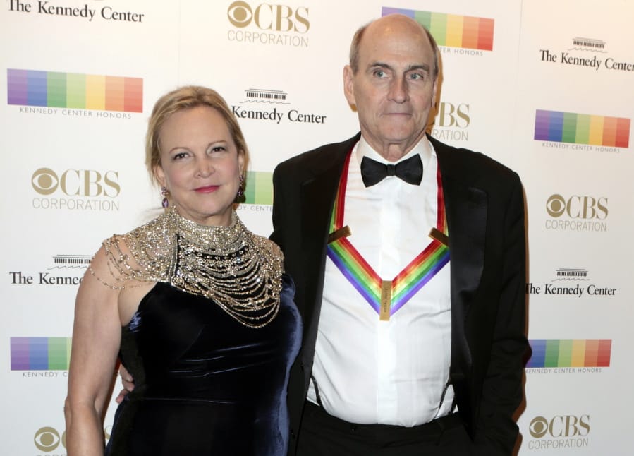 FILE - In this Dec. 4, 2016 file photo, Kim Taylor, left, and her husband James Taylor appear at the 39th Annual Kennedy Center Honors in Washington, D.C. The couple have donated $1 million to Massachusetts General Hospital in Boston to help with its battle against the spread of the new coronavirus. The gift, announced Tuesday, March 24, 2020, will help the hospital direct resources where the need is greatest, the hospital said in a statement.