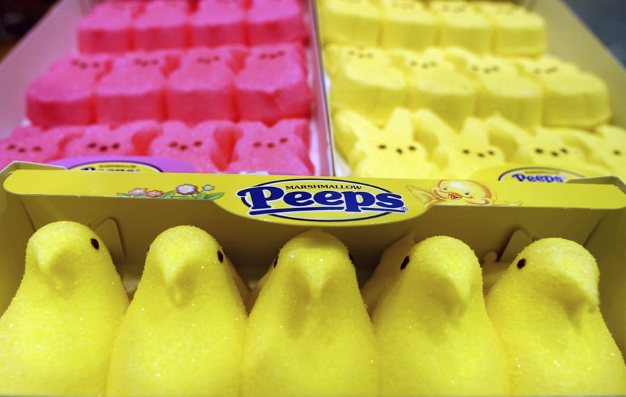 FILE - In this April 2, 2003 file photo, boxes of Marshmallow Peeps are lined up at the Just Born factory in Bethlehem, Pa.  The Bethlehem, Pa.,-based Just Born confections company said its production facilities there and in Philadelphia closed Wednesday, March 25, 2020, through April 7.