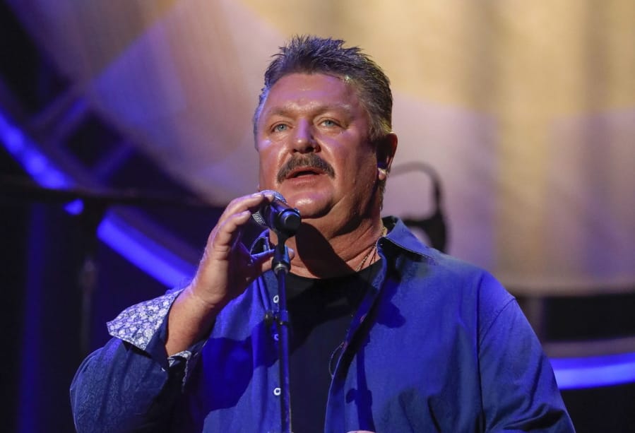 FILE - This Aug. 22, 2018 file photo shows Joe Diffie performing at the 12th annual ACM Honors in Nashville, Tenn. A publicist for Diffie says the country singer has tested positive for COVID-19. Diffie is under the care of medical professionals and is receiving treatment.