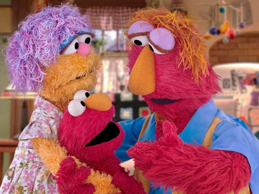 This undated image provided by Sesame Workshop shows Elmo and his parents Louie and Mae. Sesame Workshop announced Monday, March 30, 2020, that Elmo, Rooster and Cookie Monster are featured in some of four new animated public service spots reminding young fans to take care while doing such things as washing hands and sneezing. The content, which will be translated into 19 languages, is part of Sesame Workshop&#039;s Caring for Each Other initiative to help families stay physically and mentally healthy during the coronavirus pandemic.