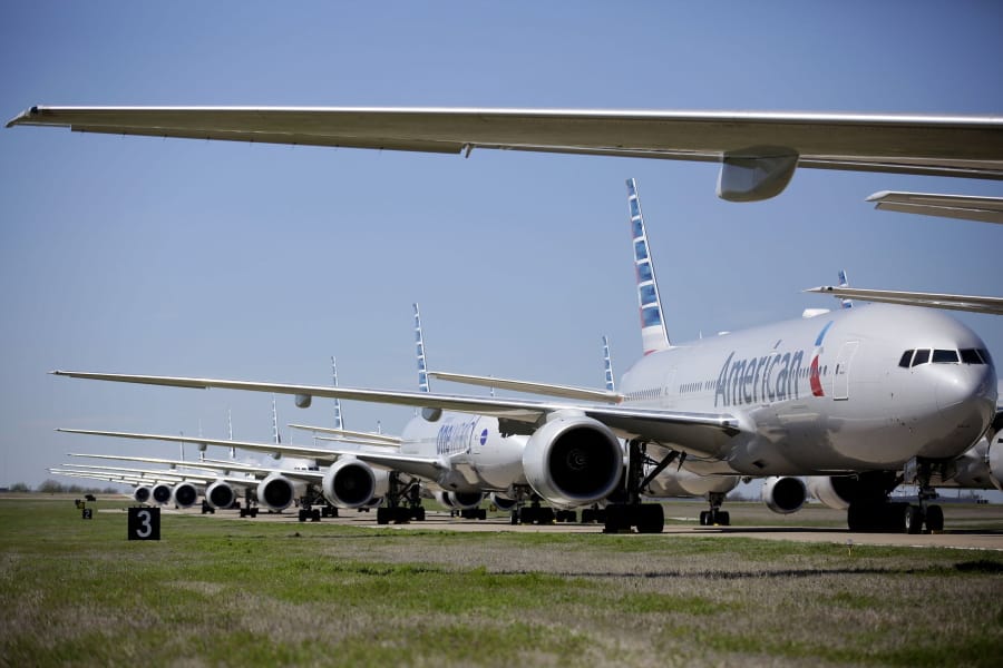 American Airlines 777&#039;s airplanes are parked at Tulsa International Airport Wednesday, March 25, 2020. American Airlines has 44 out of service airplanes parked at the airport due to a reduced flight schedule because of the COVID-19 coronavirus pandemic.