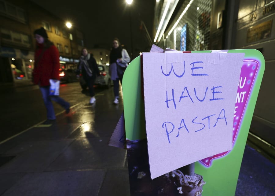 A sign notifying the availability of pasta in the wake of the coronavirus outbreak Thursday, outside Warwick Way Food &amp; Wine in Victoria, London.