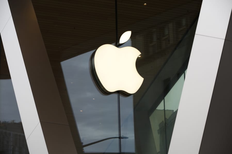 An Apple logo adorns the facade of the downtown Brooklyn Apple store in New York on Saturday, March 14, 2020. Apple has said it would close most of its retail stores outside mainland China, Hong Kong and Taiwan for two weeks.