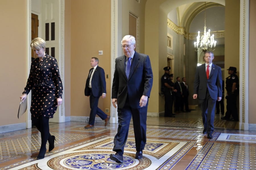 Senate Majority Leader Mitch McConnell of Ky. walks to the Senate chamber on Capitol Hill in Washington, Tuesday, March 24, 2020.