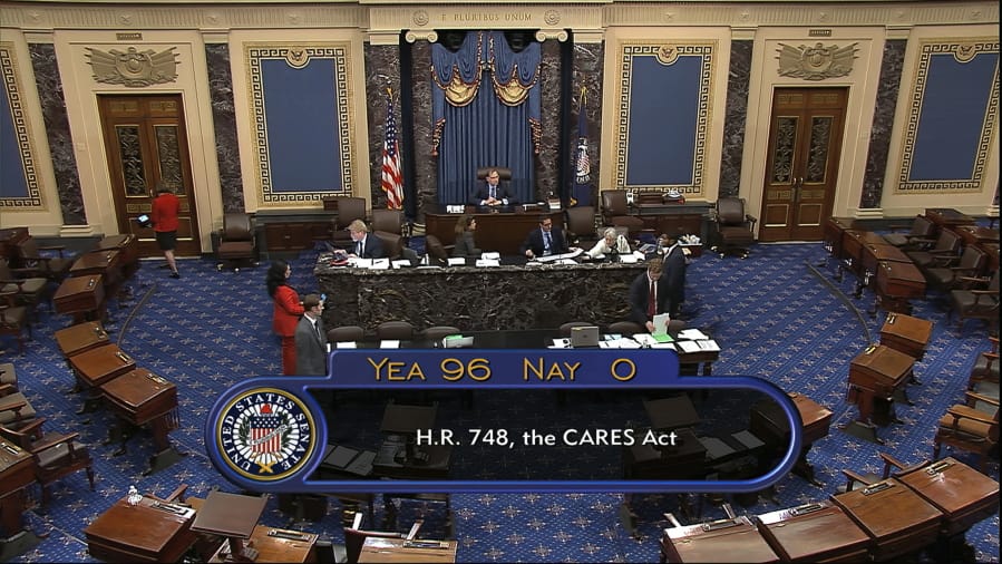 In this image from video, the final vote of 96-0 shows passage of the $2.2 trillion economic rescue package in response to coronavirus pandemic, passed by the Senate at the U.S. Capitol in Washington, Wednesday, March 25, 2020.