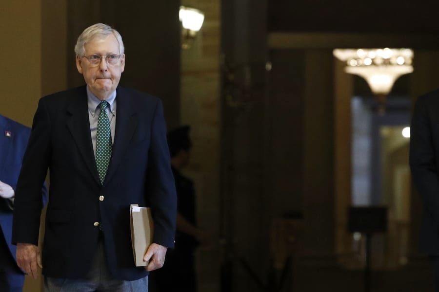 Senate Majority Leader Mitch McConnell of Ky. walks to the Senate Chamber on Capitol Hill in Washington, Monday, March 16, 2020.