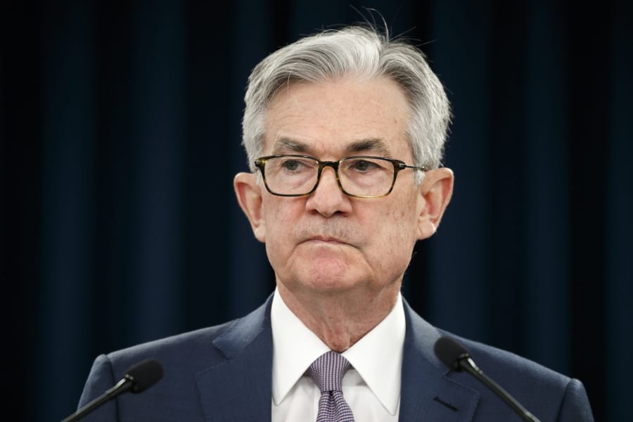 FILE - In this March 3, 2020 file photo, Federal Reserve Chair Jerome Powell pauses during a news conference in Washington.  The Federal Reserve says it will buy short-term loans from banks and companies to support the flow of credit as the economy grinds to a halt amid the viral outbreak.