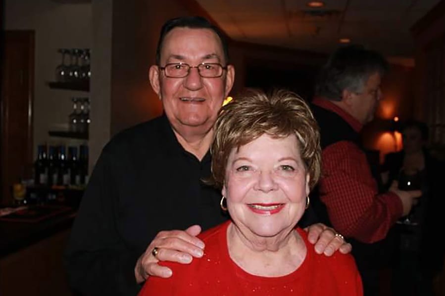 In this 2011 family photo provided by Dawn Bouska, Charles Recka and his wife, Patricia Recka, pose for a photo at a banquet in Naperville, Ill. Charles Recka died on March 12, 2020. Deep into the obituary for 87-year-old Recka is the short announcement that &quot;a Mass Celebrating his life will be held at a later date,&quot; a quiet signal popping up in death notices all over the country that the coronavirus that&#039;s changed everything about our lives has dramatically changed the way we grieve for the dead, too.