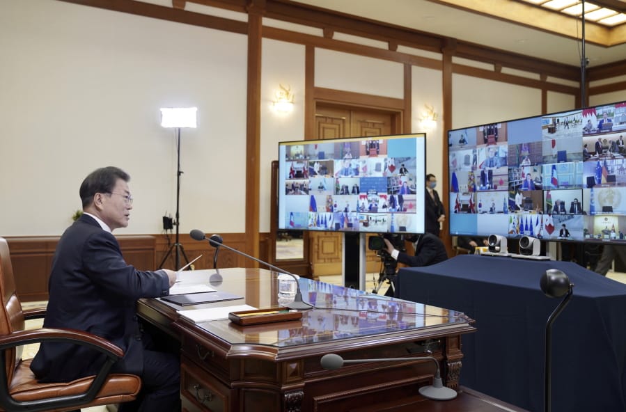 In this photo provided by South Korea Presidential Blue House via Yonhap News Agency, South Korean President Moon Jae-in attends G-20 virtual summit to discuss the coronavirus disease outbreak at the presidential Blue House in Seoul, South Korea, Thursday, March 26, 2020. Leaders of the world&#039;s most powerful economies will convene virtually to coordinate a response to the fast-spreading new coronavirus. The new coronavirus causes mild or moderate symptoms for most people, but for some, especially older adults and people with existing health problems, it can cause more severe illness or death.