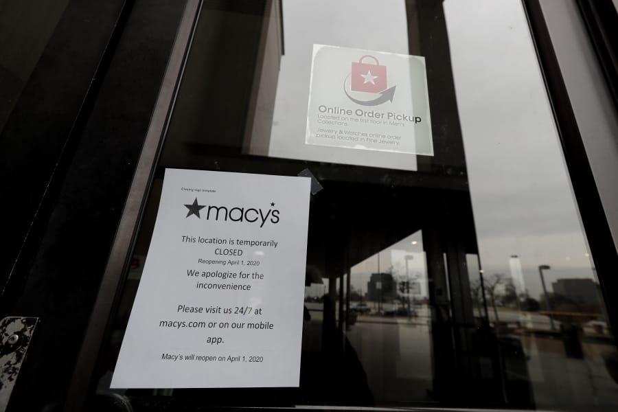 A sign is seen in front of Macy&#039;s window at Woodfield Mall in Schaumburg, Ill., Wednesday, March 18, 2020. Macy&#039;s has announced it will temporarily close all stores in response to COVID-19 outbreak in the U.S. For most people, the new coronavirus causes only mild or moderate symptoms. For some it can cause more severe illness. (AP Photo/Nam Y.