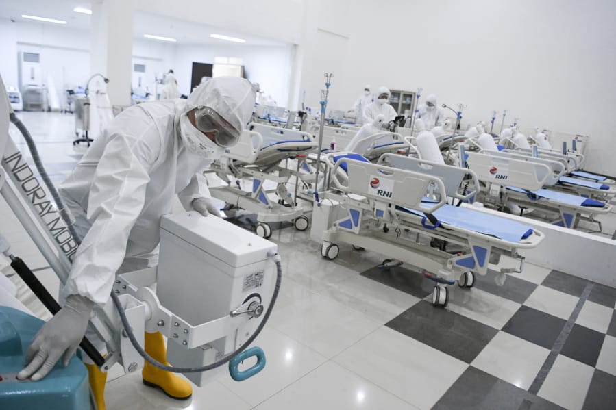 Staff inspect medical equipments at an emergency hospital set up amid the new coronavirus outbreak in Jakarta, Indonesia, Monday, March 23, 2020. Indonesia has changed towers built to house athletes in the 2018 Asian Games to emergency hospitals with a 3,000-bed capacity in the country&#039;s hard-hit capital, where new patients have surged in the past week.