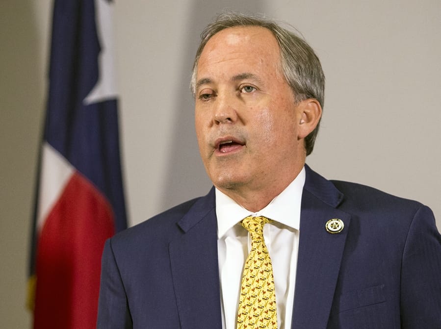 FILE - In this May 1, 2018, file photo, Texas Attorney General Ken Paxton speaks at a news conference in Austin, Texas. The state of Texas has filed suit against a Houston auctioneer, accusing him of price-gouging in his auctioning of 750,000 medical-grade and N95 face masks, Paxton&#039;s office announced Thursday, March 26, 2020.