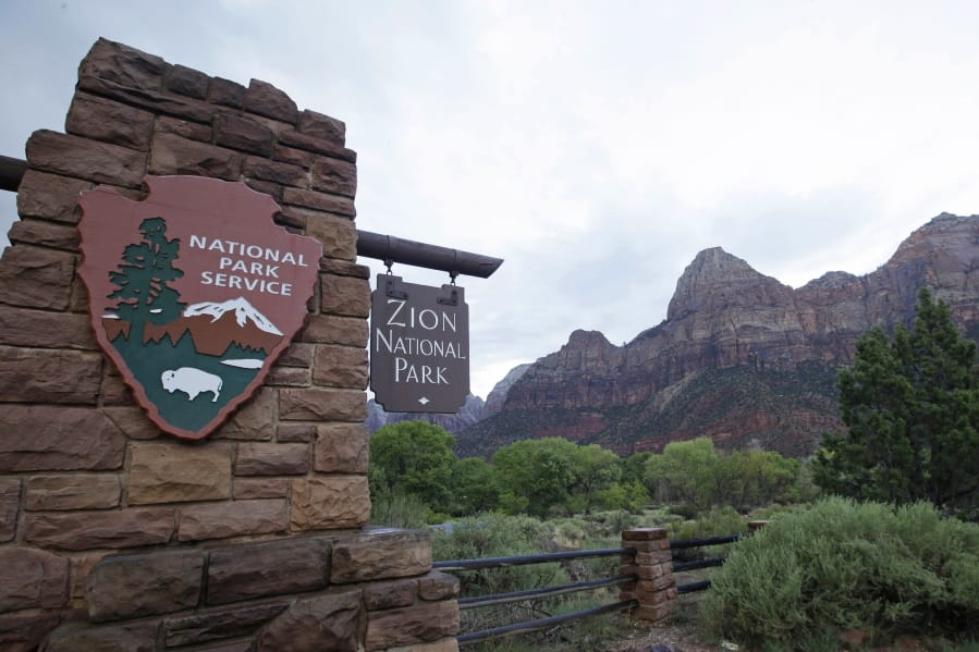 FILE - This Sept. 15, 2015, file photo, shows Zion National Park near Springdale, Utah. Zion National Park announced Monday, Marc h 23, 2020, it is closing its campgrounds and part of a popular trail called Angel&#039;s Landing that is often crowded with people.