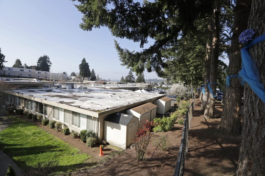 The single-story Life Care Center is seen Wednesday, March 18, 2020, in Kirkland, Wash. Staff members who worked while sick at multiple long-term care facilities contributed to the spread of COVID-19 among vulnerable elderly in the Seattle area, federal health officials said Wednesday.