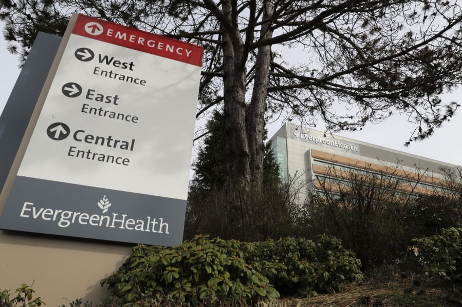 A sign for EvergreenHealth Medical Center is shown Tuesday in Kirkland near Seattle. Hospitals are gearing up for an onslaught of coronavirus patients, but staff on the front lines are stretched thin and don&#039;t have the equipment they need to protect themselves from the highly contagious virus. (Ted S.