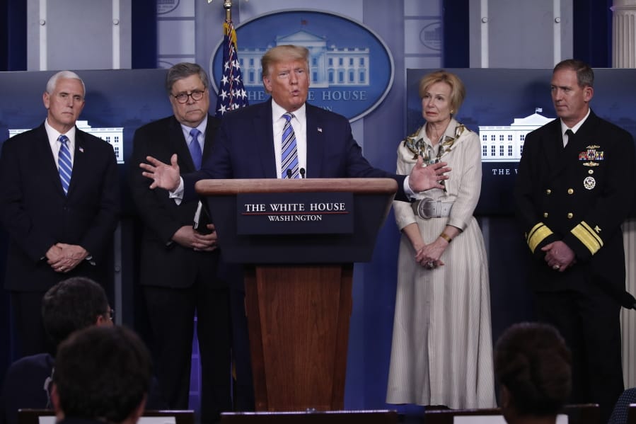 President Donald Trump takes questions from reporters as he speaks about the coronavirus in the James Brady Briefing Room, Monday, March 23, 2020, in Washington. Listens from left are Vice President Mike Pence, Attorney General William Barrm Dr. Deborah Birx, White House coronavirus response coordinator, and Navy Rear Adm.