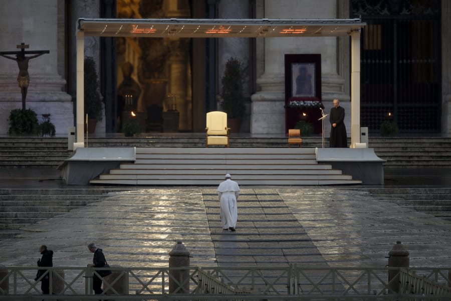 Pope Francis arrives to deliver an Urbi et orbi prayer from the empty St. Peter&#039;s Square, at the Vatican, Friday, March 27, 2020. Praying in a desolately empty St. Peter&#039;s Square, Pope Francis on Friday likened the coronavirus pandemic to a storm laying bare illusions that people can be self-sufficient and instead finds &quot;all of us fragile and disoriented&quot; and needing each other&#039;s help and comfort.