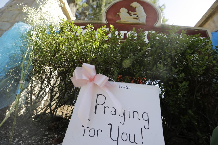 A handmade sign sits against the entry at Life Care Center Monday, March 16, 2020, in Kirkland, Wash., near Seattle. The facility has been the epicenter of the coronavirus outbreak in the state.