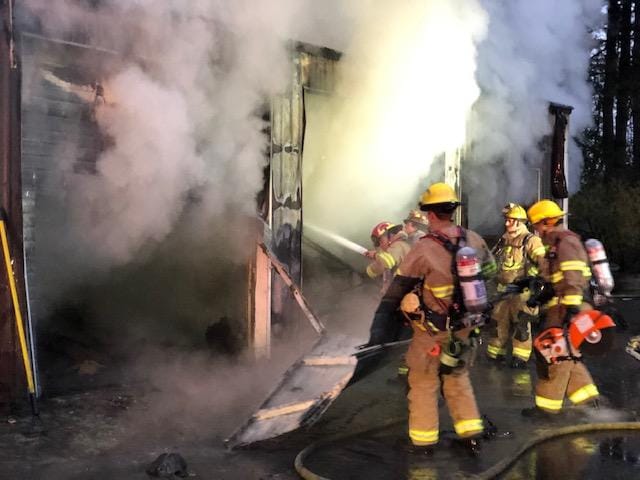 Clark County Fire & Rescue personnel battle a barn fire on 239th Street.