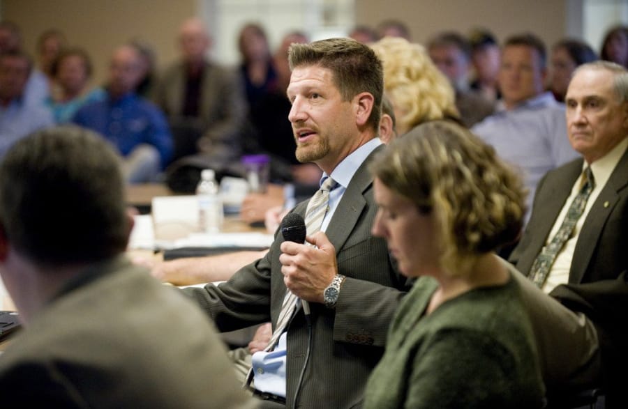 Paul Dennis, then- executive director of the Camas Washougal Economic Development Association, speaks to a joint meeting of the Camas and Washougal city councils in 2011.