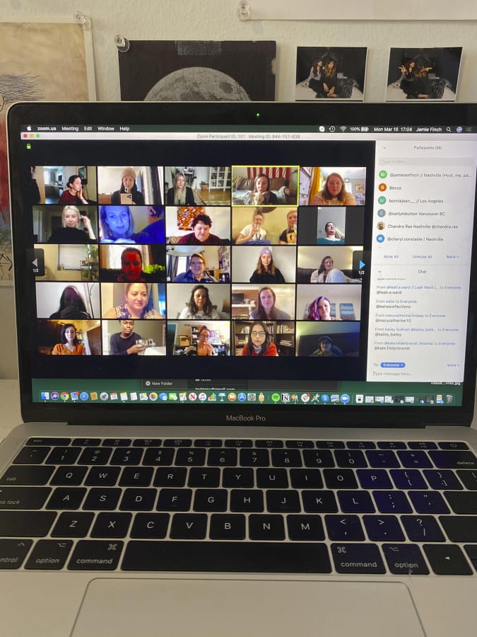 People gather on Zoom, a video conferencing app. Companies and friend groups across the U.S. are video chatting to keep spirits high.
