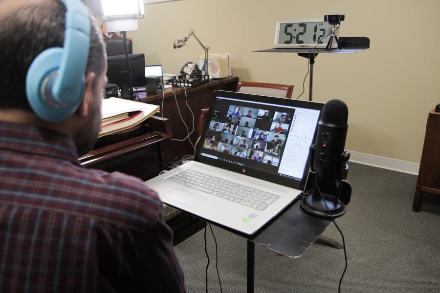 Jeffrey Smith, artistic director and conductor of the Philadelphia Boys Choir and Chorale, leads a virtual rehearsal with dozens of young choir members March 18.