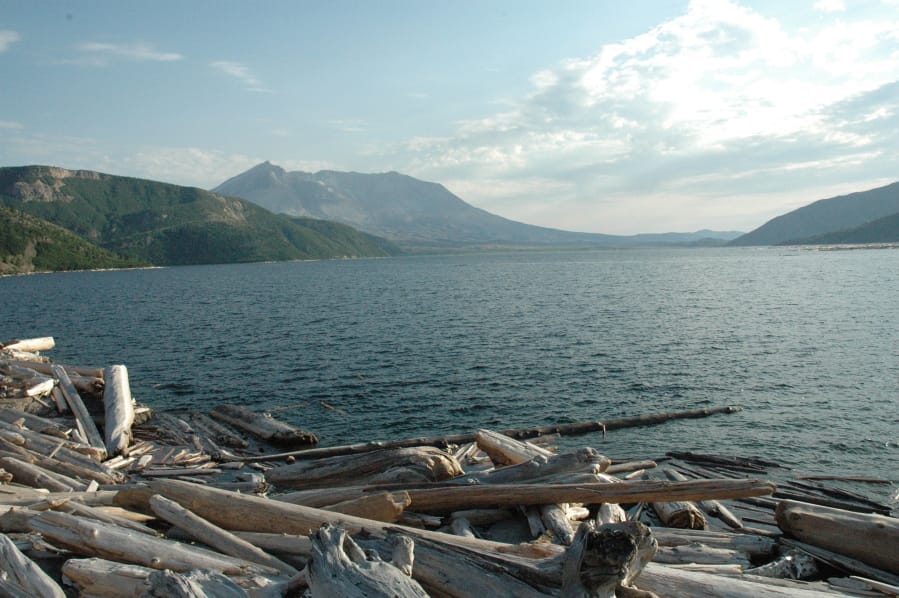 Mount St. Helens is seen from the far shore of Spirit Lake.