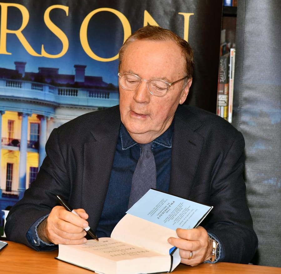 James Patterson signs copies of new book co-written with Bill Clinton &quot;The President Is Missing&quot; in 2018 at a Barnes &amp; Noble in New York City.